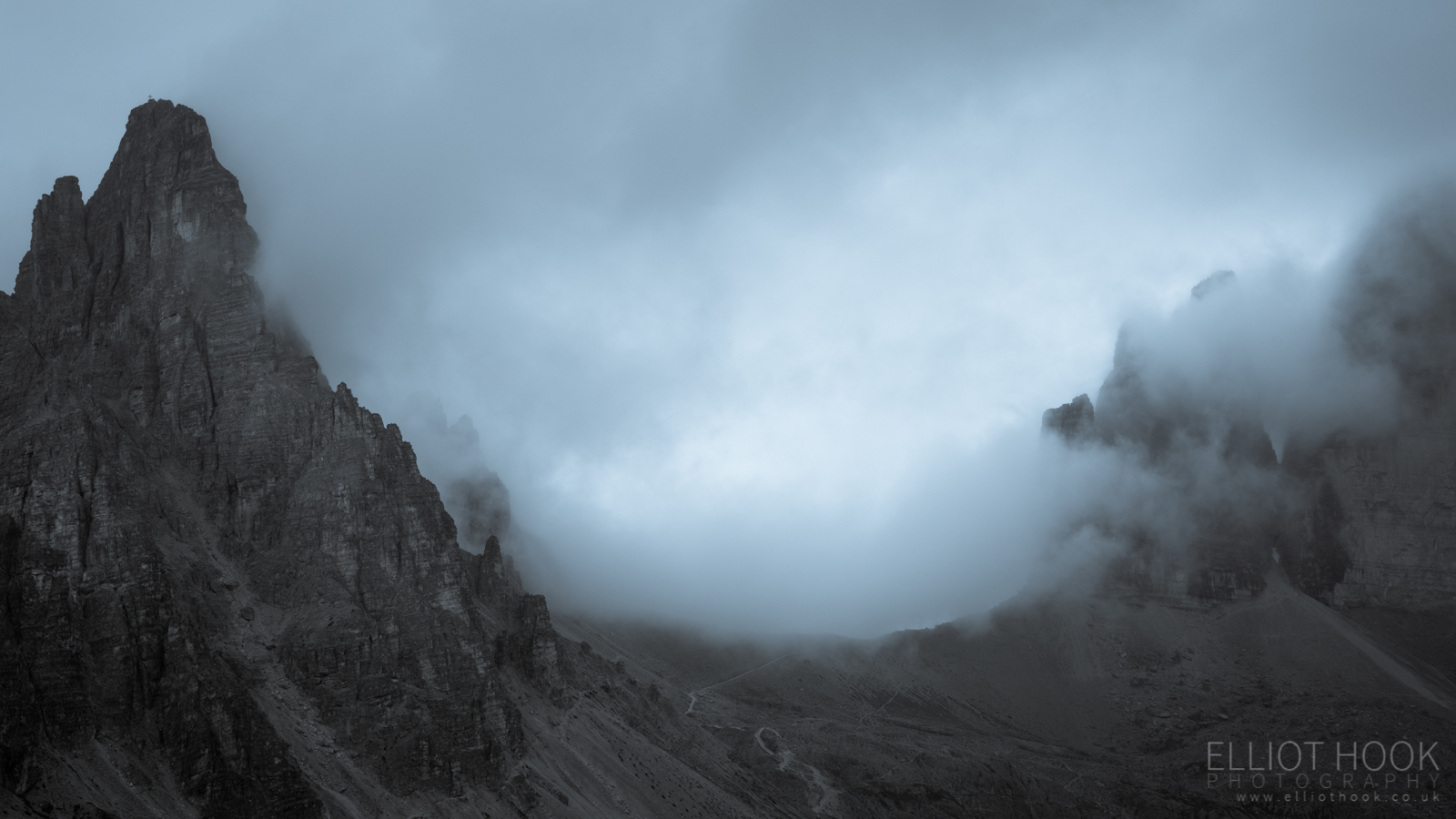 The peaks of Tre Cime shrouded in cloud