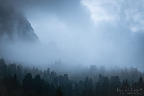 A clouded mountainside along Sella Pass, Dolomites